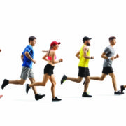 Group of diverse adults running together in a race, wearing bright athletic outfits.